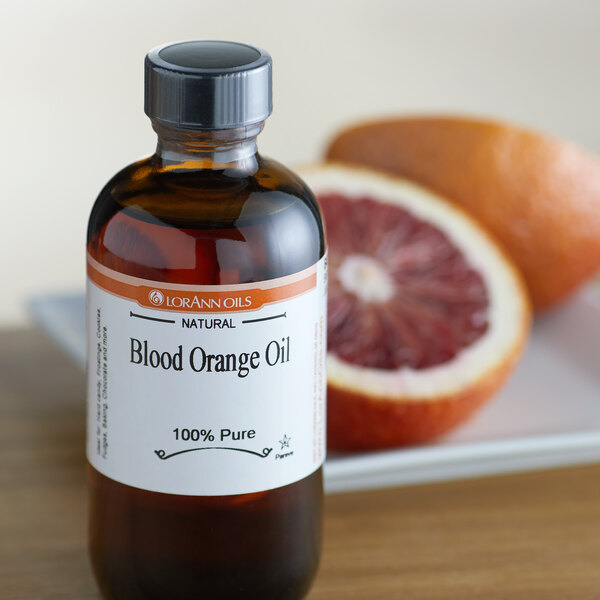 A close-up of a bottle of LorAnn Blood Orange Oil.