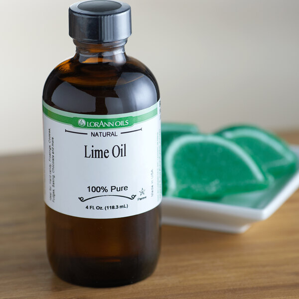 A close-up of a bottle of LorAnn Oils All-Natural Lime Super Strength Flavor on a counter.