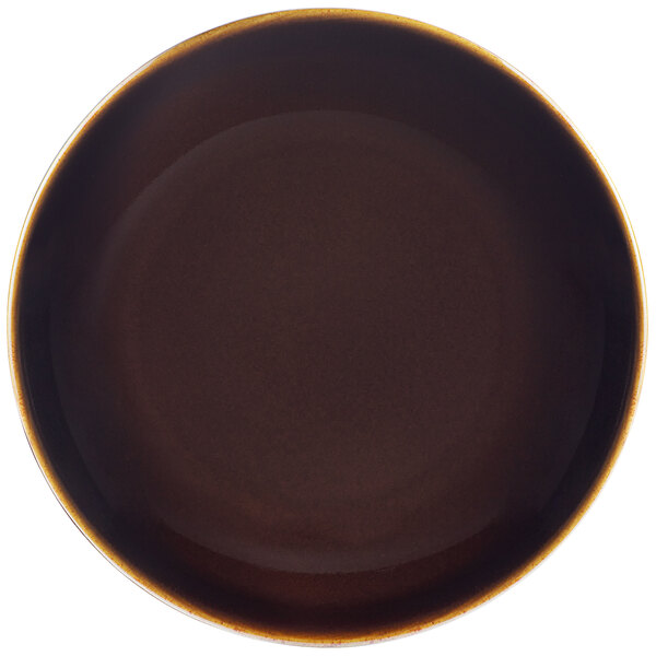 A brown porcelain plate with a white border.