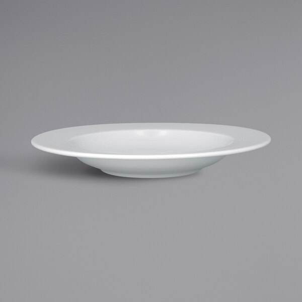 A RAK Porcelain bright white porcelain plate with an embossed rim.