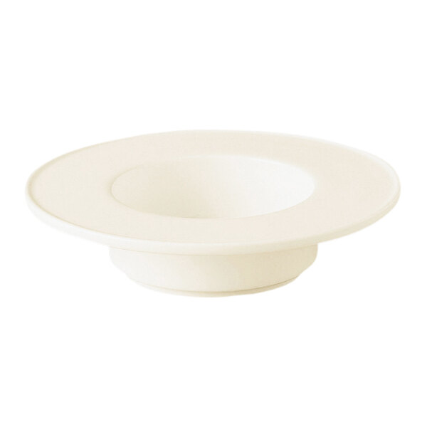 A white porcelain saucer with a white rim.