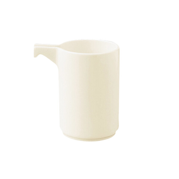 A RAK Porcelain warm white porcelain creamer with a handle.