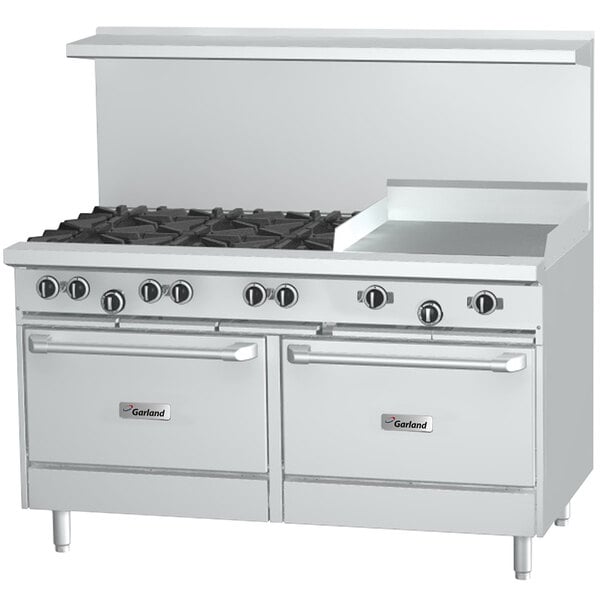 A stainless steel Garland commercial gas range on a counter with 6 burners, a griddle, and 2 storage bases.