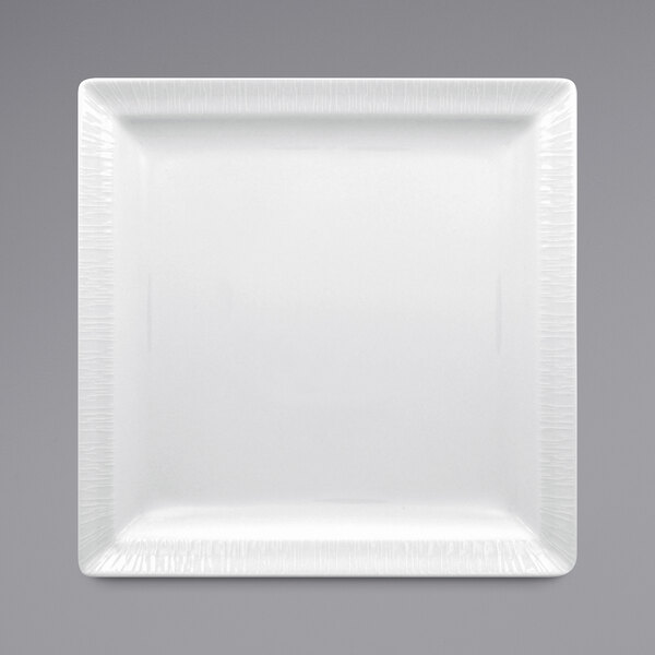 A white square RAK Porcelain plate with an embossed rim.