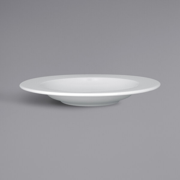 A RAK Porcelain white plate with an embossed white rim.