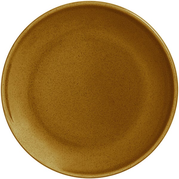 A white porcelain coupe plate with a brown speckled rim.