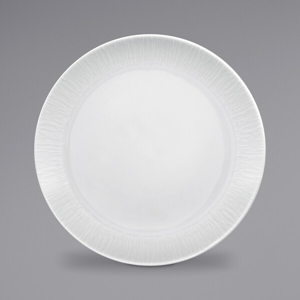 A white RAK Porcelain plate with a textured edge.
