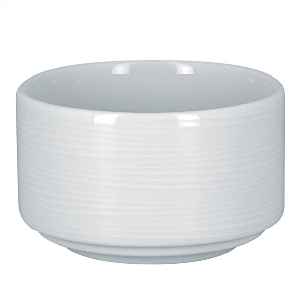 A RAK Porcelain bright white round stackable bouillon cup with an embossed rim.