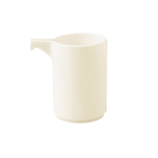 A RAK Porcelain warm white porcelain creamer with a handle.