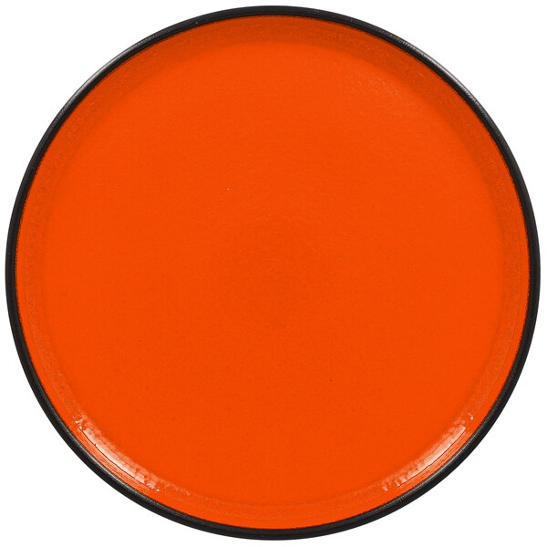 An orange RAK Porcelain rimless plate.