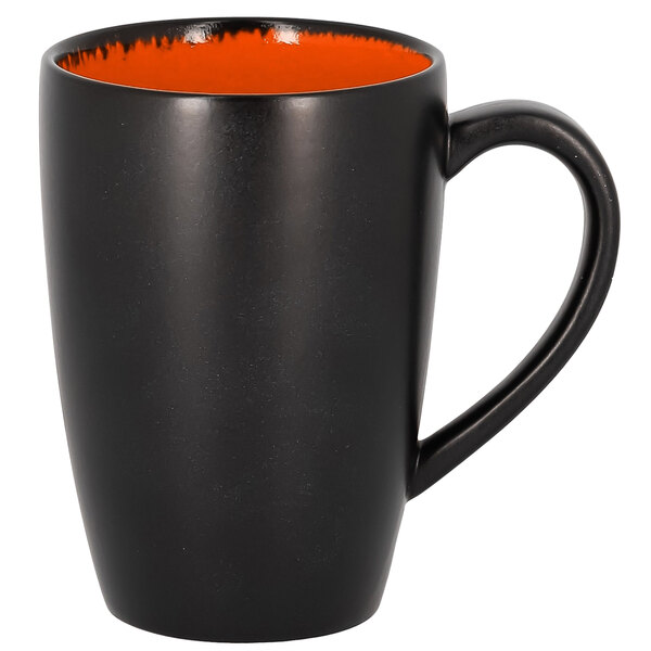 A black and orange RAK Porcelain Flora mug with a handle.