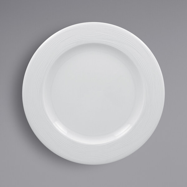 A RAK Porcelain bright white porcelain plate with an embossed wide rim.