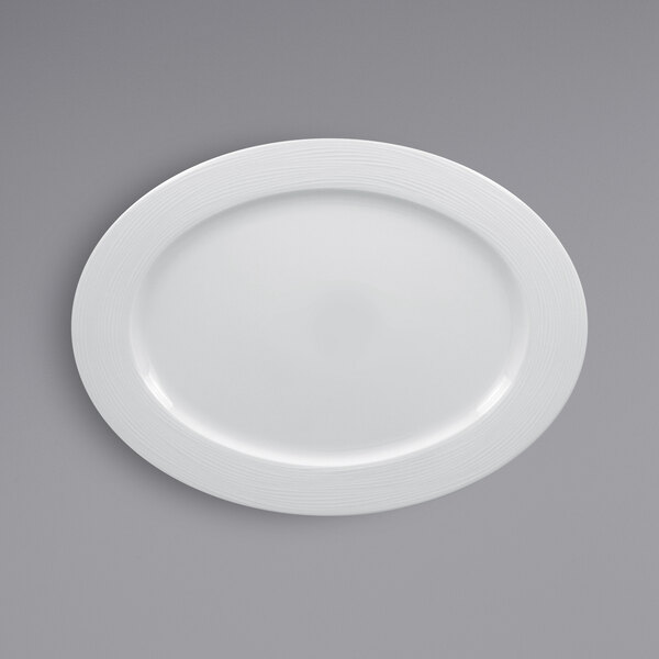 A white RAK Porcelain oval plate with a wide rim.