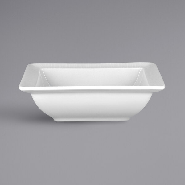 A RAK Porcelain bright white square porcelain salad bowl with an embossed design.