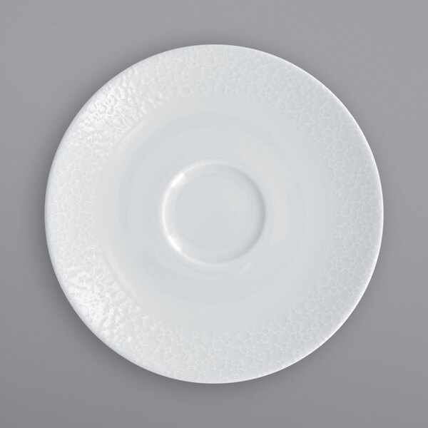 A RAK Porcelain bright white saucer with a circular pattern.