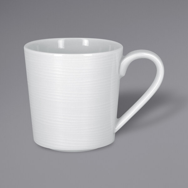 A RAK Porcelain bright white mug with a handle.