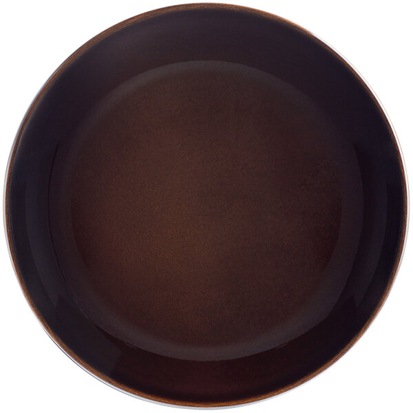A brown porcelain coupe plate with a black rim on a white background.