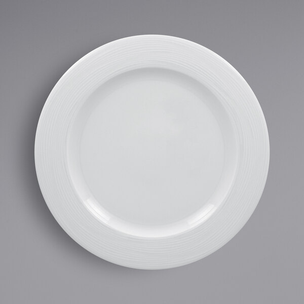 A RAK Porcelain white plate with an embossed white wide rim.