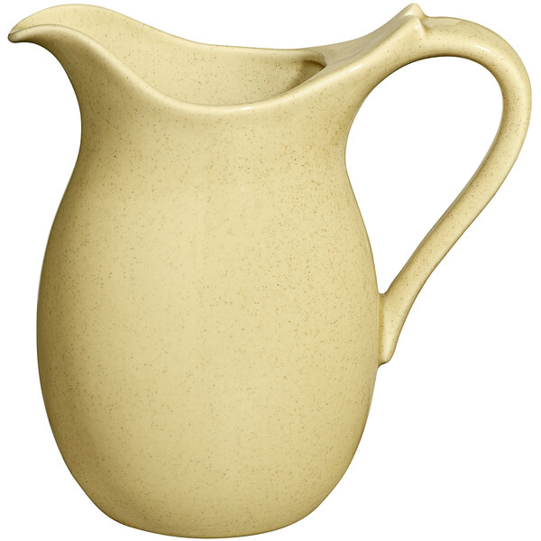 A cream colored RAK Porcelain jug with a handle.