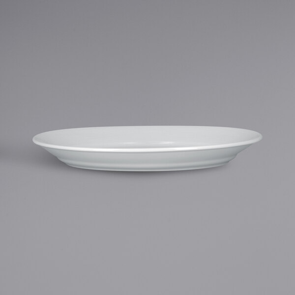 A white RAK Porcelain oval deep plate with an embossed rim.