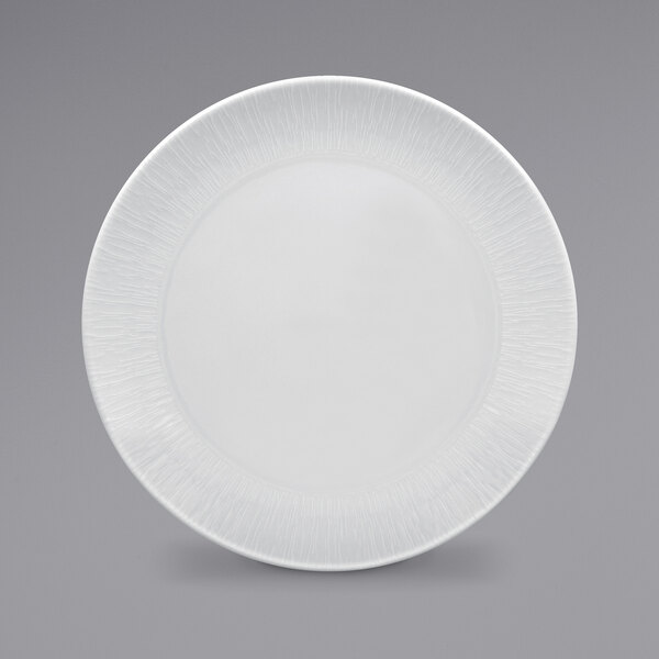 A RAK Porcelain bright white plate with a textured pattern.