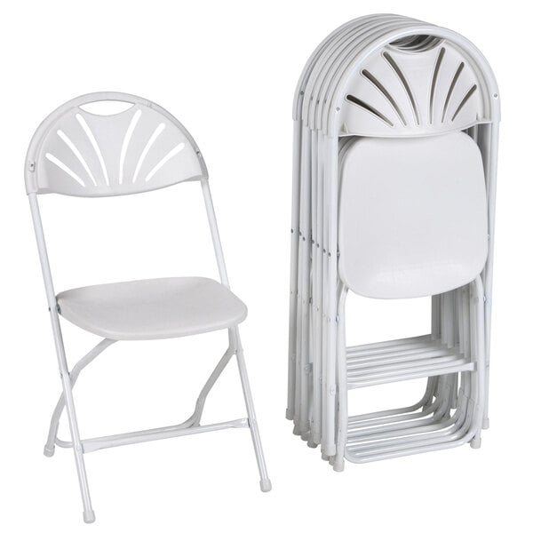 A stack of ZOWN Premium white plastic folding chairs with a fan design on the back.