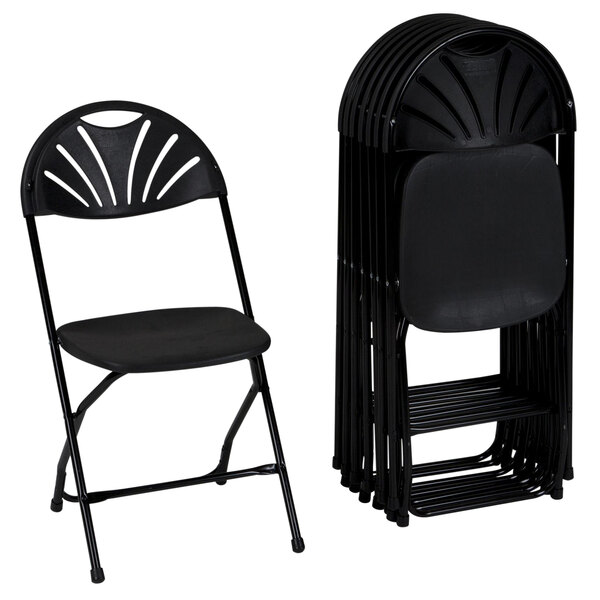 A stack of ZOWN Premium black folding chairs with a fan design on the back.