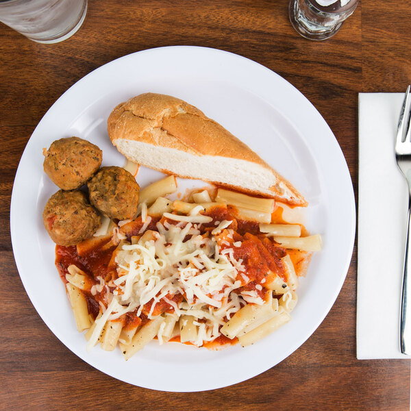 A white Carlisle melamine plate with pasta, meatballs, and bread.
