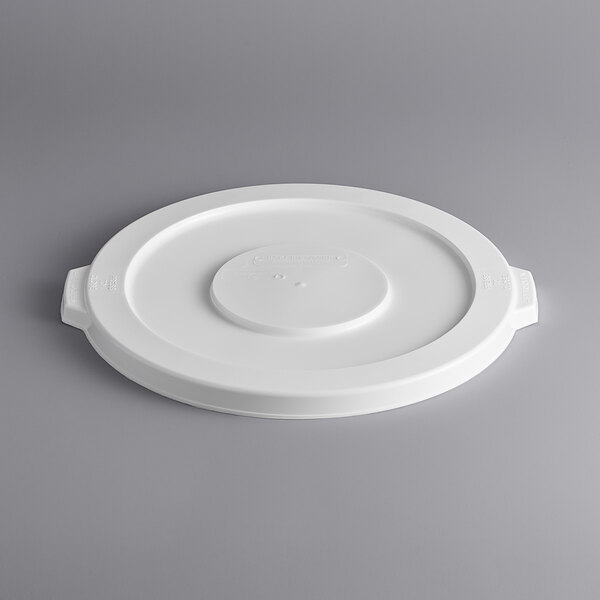 A white plastic lid with a circle on it.