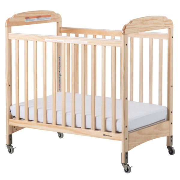 Foundations 2532040 Serenity 24" x 38" Natural Compact Fixed-Side Clearview Wood Crib with Adjustable Mattress Board and 3" InfaPure Mattress