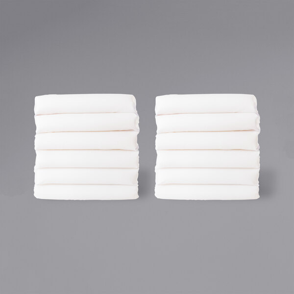 A stack of white folded sheets.