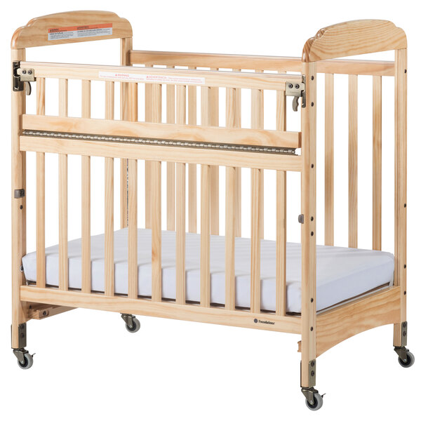 Foundations 2542040 Serenity SafeReach 24" x 38" Natural Compact Clearview Wood Crib with Safety Access Gate, Adjustable Mattress Board, and 3" InfaPure Mattress