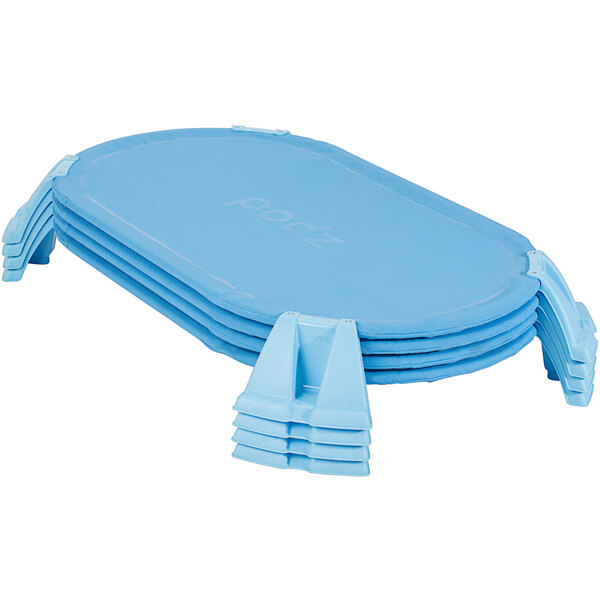 A stack of blue ergonomic toddler cots.
