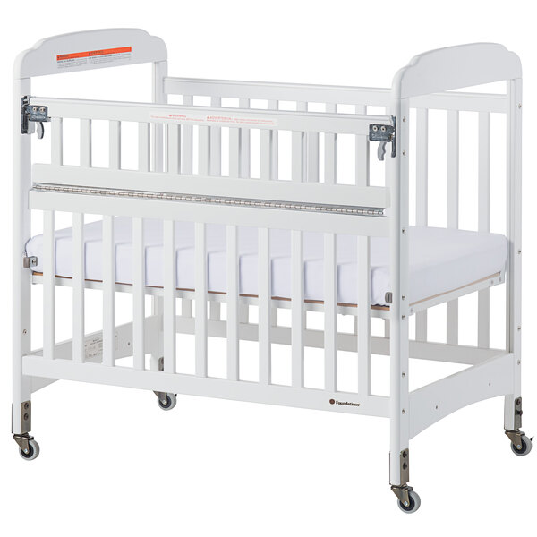 Foundations 2542120 Serenity SafeReach 24" x 38" White Compact Clearview Wood Crib with Safety Access Gate, Adjustable Mattress Board, and 3" InfaPure Mattress
