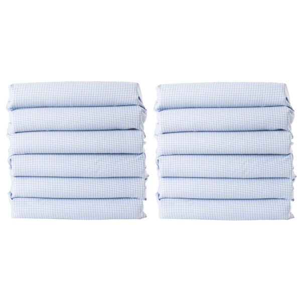 A stack of six blue gingham CozyFit toddler cot sheets.