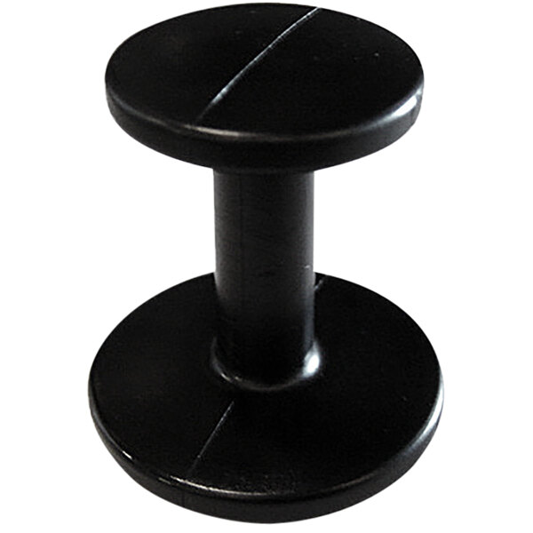 A close-up of a black plastic tamper with a round base.