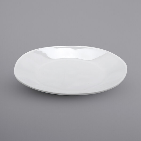 A white irregular melamine bowl with a small rim.