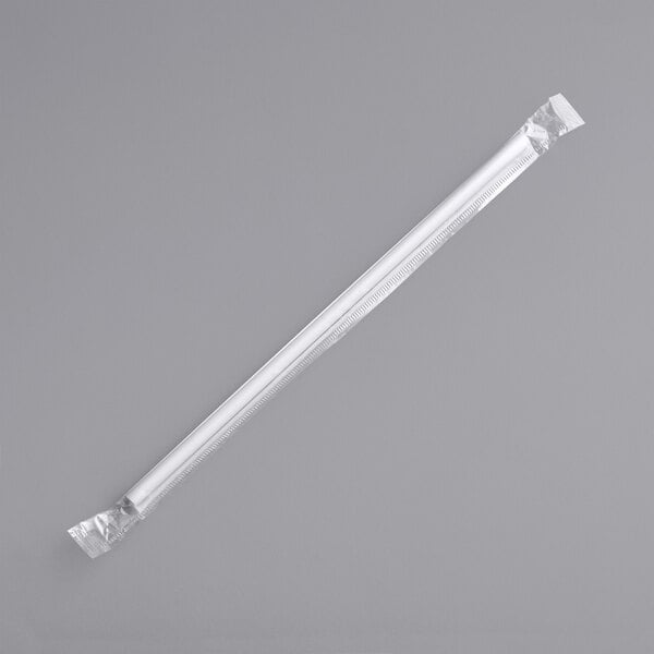 A clear plastic straw in a white plastic wrapper.