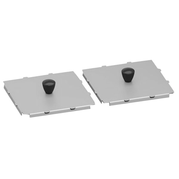Two metal plates with silver surfaces and black knobs.