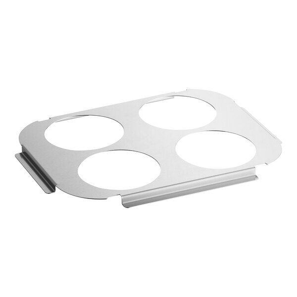 A white metal plate with four circles.