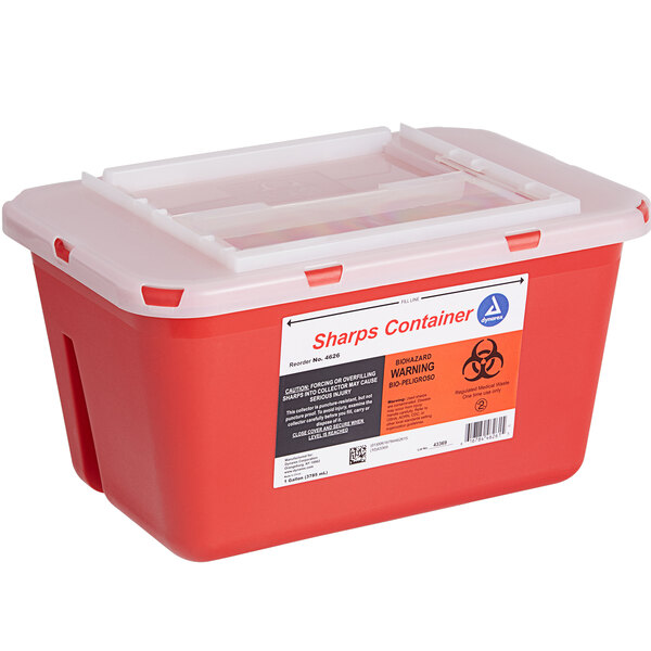 A red plastic Medique sharps container with a white lid.