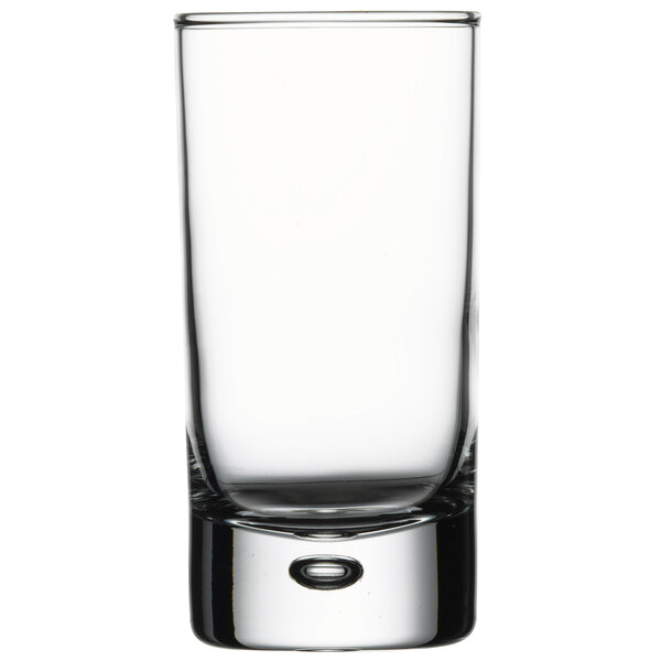 A close up of a clear Pasabahce Centra shot glass with a small rim.