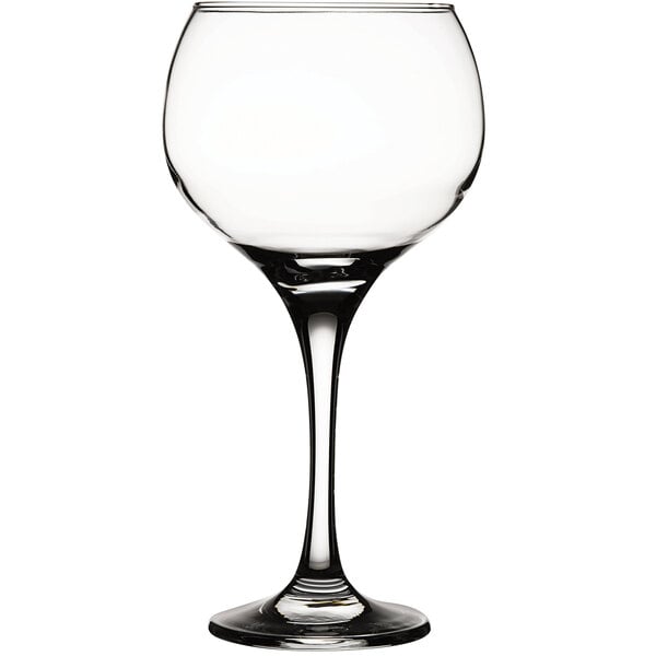A close-up of a Pasabahce Ambassador clear wine glass with a stem.