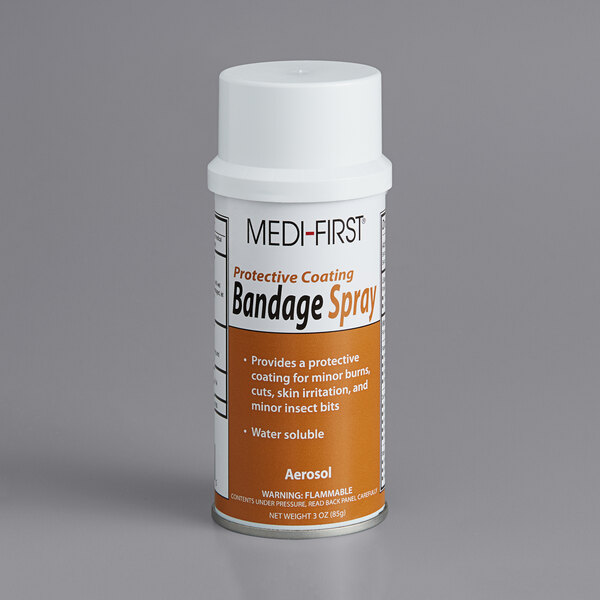 A white and orange Medique bottle of Medfirst bandage spray.