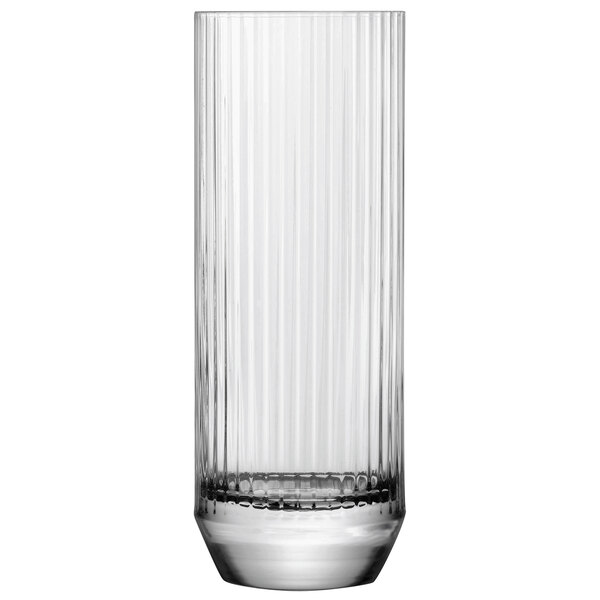 A close up of a clear Nude Big Top highball glass with vertical lines.