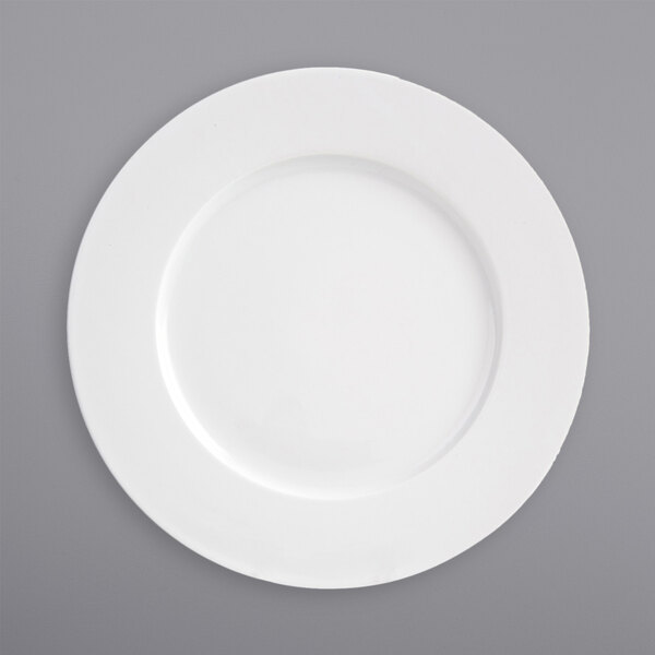 A white plate with a wide white rim.
