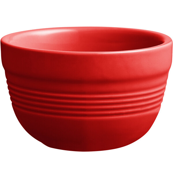 An Acopa Capri red stoneware bouillon bowl with a handle.