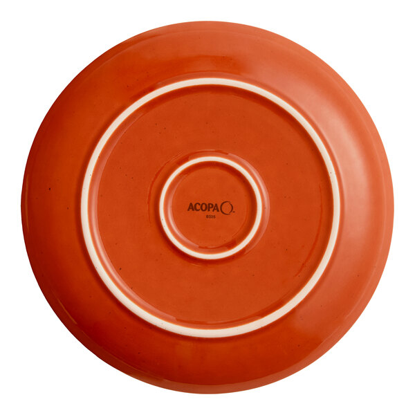 An orange porcelain coupe plate with a circular base and the brand name 'Acopa' printed on the bottom.