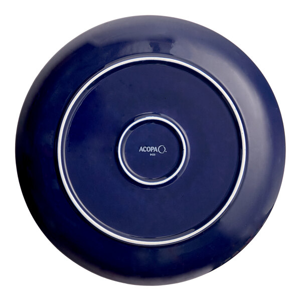 A blue porcelain coupe plate with a circular design and the brand name 'Acopa' on the bottom.
