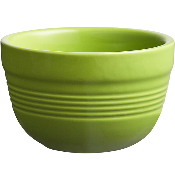 An Acopa Capri bamboo green stoneware bouillon with lines on it.